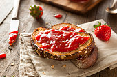 Close-up of toast with homemade strawberry jam on table