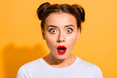 Close-up portrait of her she nice attractive lovely puzzled girl opened mouth stunning news isolated over bright vivid shine yellow background