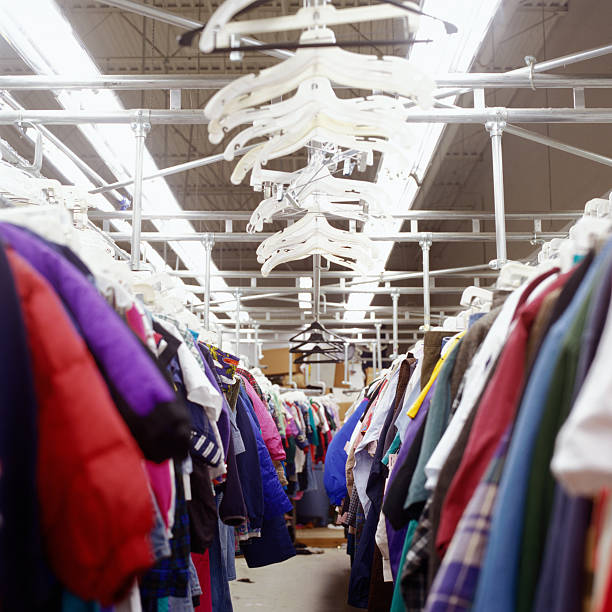 clothes racks with plastic hangers low angle view picture