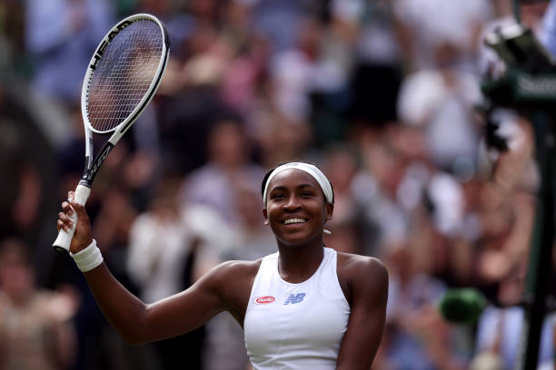 Coco Gauff celebrates winning her Ladies' Singles third round match against Kaja Juvan on day six of Wimbledon at The All England Lawn Tennis and...
