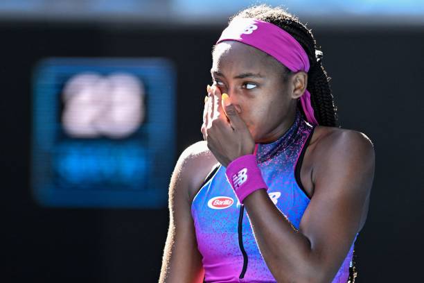 Coco Gauff of the US reacts after a point against China's Wang Qiang during their women's singles match on day one of the Australian Open tennis...