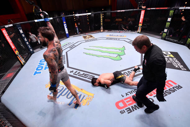 Cody Garbrandt celebrates after his knockout victory over Raphael Assuncao of Brazil in their bantamweight bout during the UFC 250 event at UFC APEX...