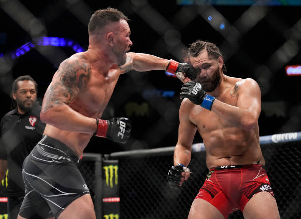 Colby Covington punches Jorge Masvidal in their welterweight fight during the UFC 272 event on March 05, 2022 in Las Vegas, Nevada.