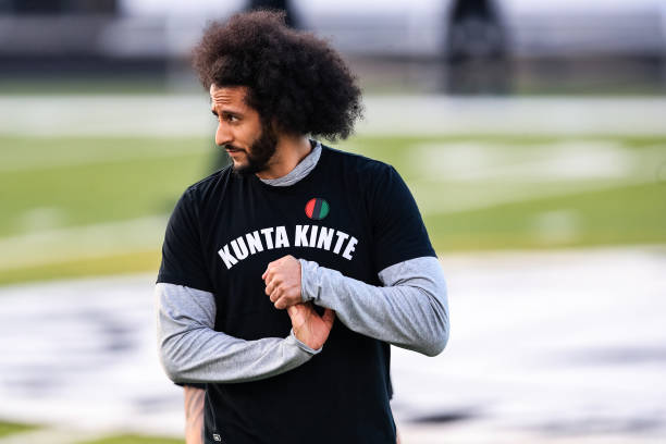 Colin Kaepernick looks on during his NFL workout held at Charles R Drew high school on November 16, 2019 in Riverdale, Georgia.