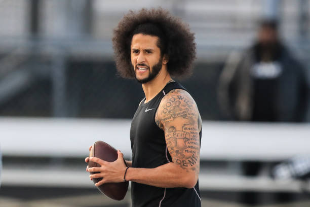 Colin Kaepernick looks to make a pass during a private NFL workout held at Charles R Drew high school on November 16, 2019 in Riverdale, Georgia. Due...