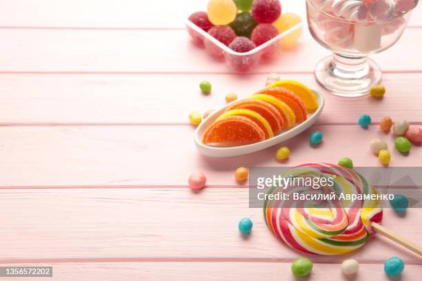 colorful candies lollipops jelly pink background