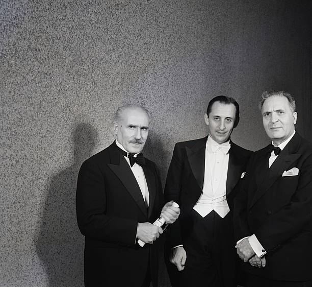 Conductor Arturo Toscanini attends his son-in-law, pianist Vladimir Horowitz's recital in Los Angeles with fellow conductor Bruno Walter.