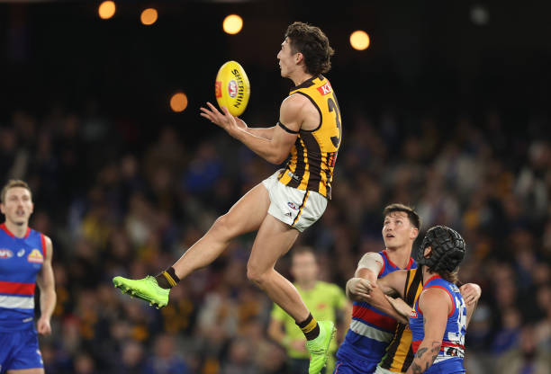 Connor Macdonald of the Hawks marks during the round 15 AFL match between the Western Bulldogs and the Hawthorn Hawks at Marvel Stadium on June 24,...