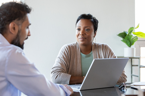 Consultant Talking With Client at a meeting