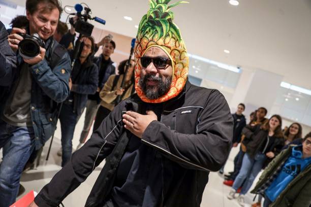 Controversial French comic Dieudonne M'bala M'bala wearing a mask depicting a pineapple makes a controversial gesture named "quenelle" as he arrives...