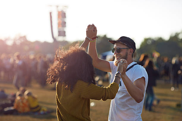 couple dancing at music festival - couple stock pictures, royalty-free photos & images