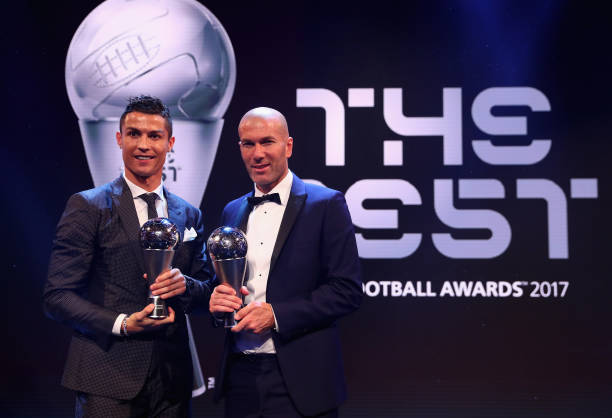 Cristiano Ronaldo and Zinedine Zidane pose for a photo accepts The Best FIFA Men's Player award during The Best FIFA Football Awards at The London...