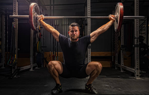 cross training - men at gym stock pictures, royalty-free photos & images