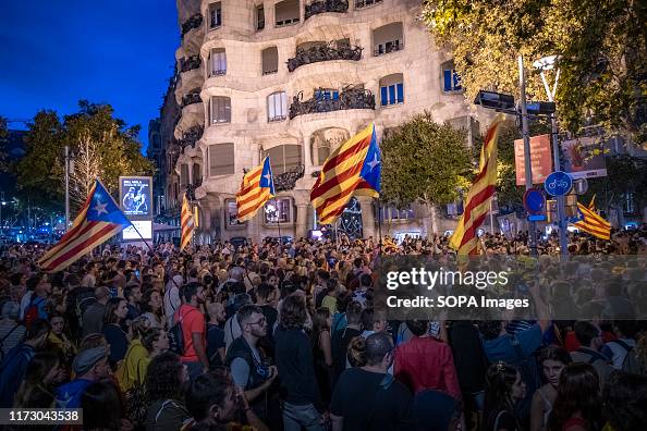 Crowd of protesters wave flags for the independence of...
