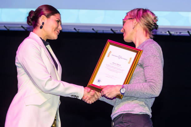 Crown Princess Victoria of Sweden gives out prizes to health care professionals during a seminar on cancer strategy at the Karolinska Institute on...