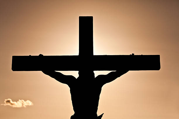 crucifixion or easter silhouette - good friday stockfoto's en -beelden
