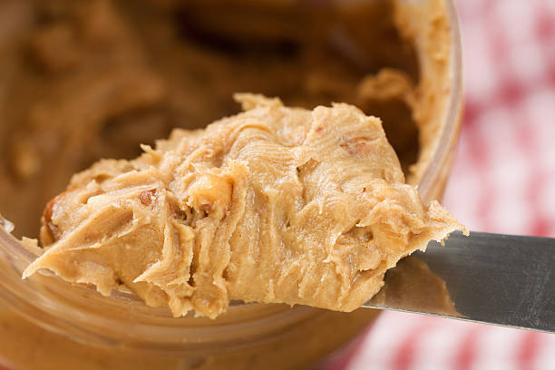 crunchy peanut butter - peanut butter stock pictures, royalty-free photos & images