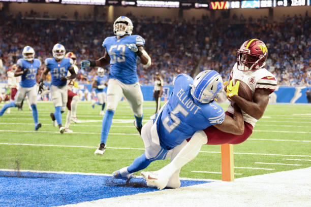 Curtis Samuel of the Washington Commanders catches a touchdown against DeShon Elliott of the Detroit Lions at Ford Field on September 18, 2022 in...