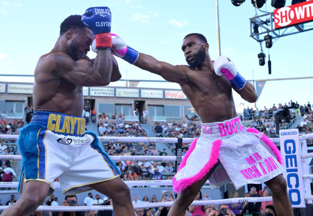 Custio Clayton exchanges punches with Jaron Ennis during their welterweight title fight at Dignity Health Sports Park on May 14, 2022 in Carson,...