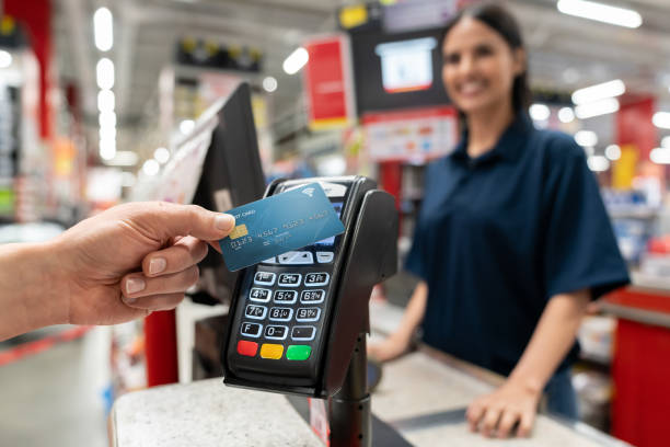 customer making a smart payment at the hardware store - credit card reader stock pictures, royalty-free photos & images