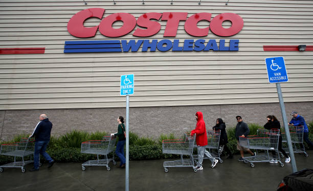 customers wait in line to enter a costco store on march 14 2020 in picture