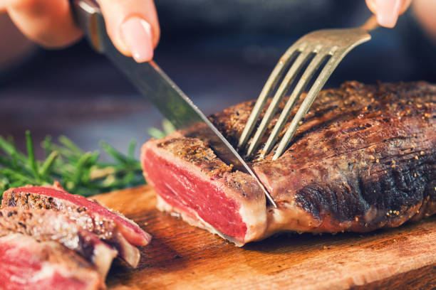 cutting juicy beef steak picture