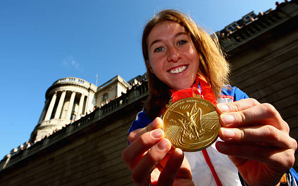 Cycling gold medalist Nicole Cooke of Great Britain displays her medal during the Olympic and Paralympic Heroes' Parade October 16, 2008 at the Mansion...