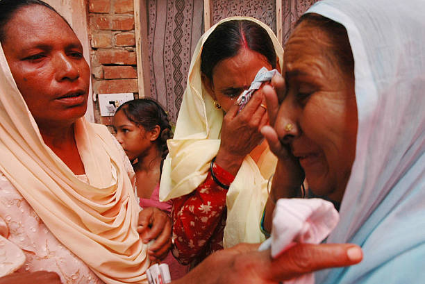 Dalbir Kaur the sister of imprisoned Sarabjit Singh and Sukhpreet Kaur the wife of Sarabjit Singh weep with relatives after their meeting political...