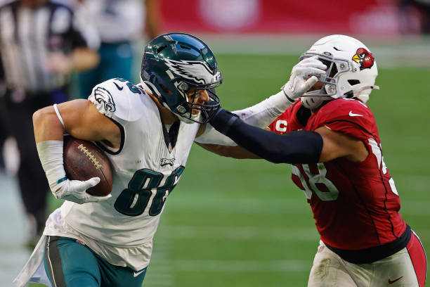 Dallas Goedert of the Philadelphia Eagles makes the reception against Jordan Hicks of the Arizona Cardinals during the second quarter at State Farm...