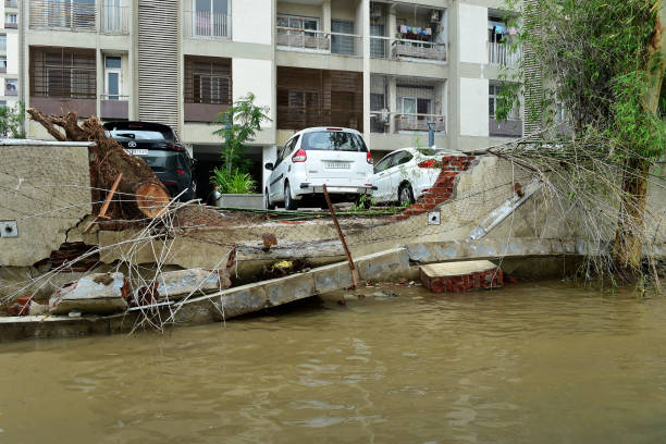 Damaged wall of a residential society is pictured after heavy rains in Ahmedabad on July 11, 2022.