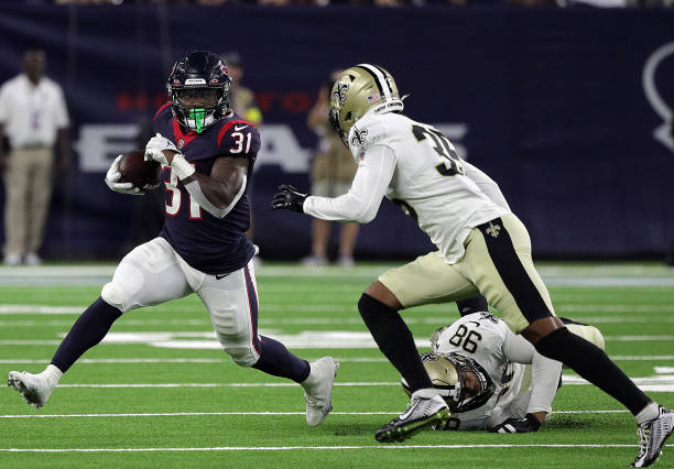 Dameon Pierce of the Houston Texans rushes in the second quarter against the New Orleans Saints during a preseason game at NRG Stadium on August 13,...
