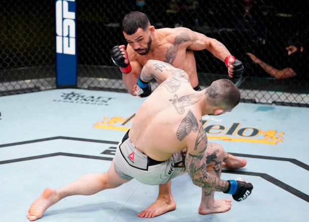 Dan Ige knocks out Gavin Tucker of Canada in a featherweight fight during the UFC Fight Night event at UFC APEX on March 13, 2021 in Las Vegas,...