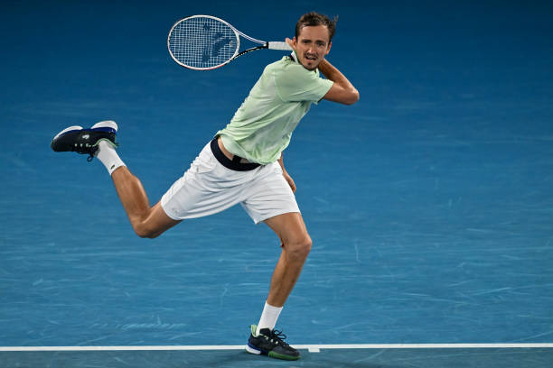 Daniel Medvedev of Russia hits a forehand against Stefanos Tsitsipas of Greece in the semi-final of the men's singles during day 12 of the 2022...