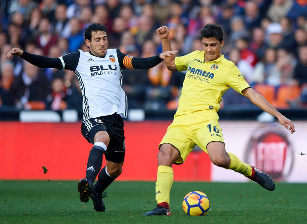 Daniel Parejo of Valencia competes for the ball with Rodrigo Hernandez of Villarreal during the La Liga match between Valencia and Villarreal at...