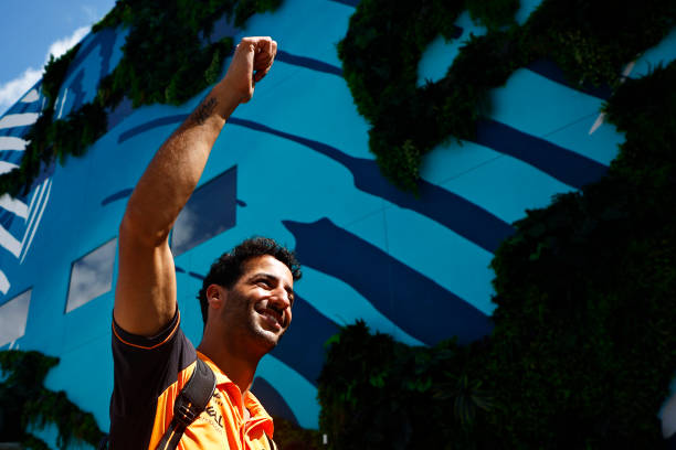 Daniel Ricciardo of Australia and McLaren waves to the crowd from the paddock prior to the F1 Grand Prix of Miami at the Miami International...