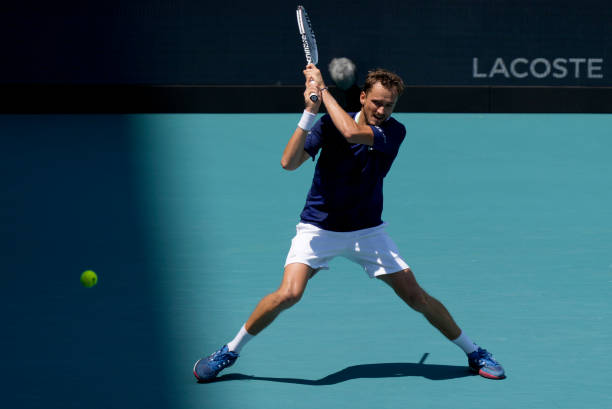 Daniil Medvedev of Russia returns a shot to Andy Murray of Great Britain during the 2022 Miami Open presented by Itaú at Hard Rock Stadium on March...