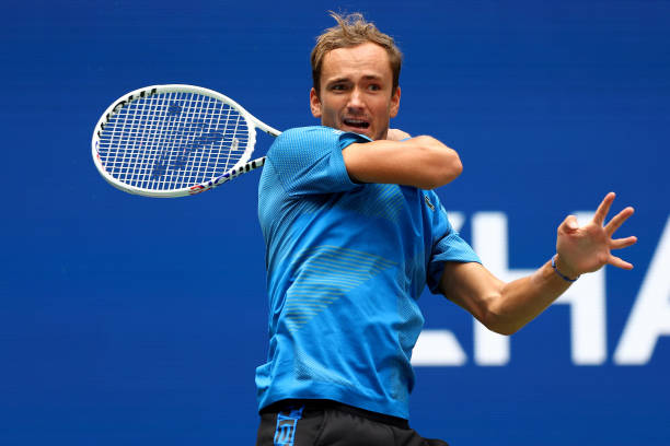 Danill Medvedev of Russia returns a shot against Stefan Kozlov of the United States during the Men's Singles First Round on Day One of the 2022 US...