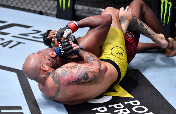 Danilo Marques of Brazil secures a rear choke submission against Mike Rodriguez in their light heavyweight fight during the UFC Fight Night event at...