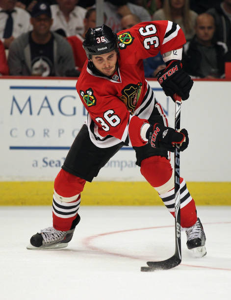 dave-bolland-of-the-chicago-blackhawks-controls-the-puck-against-the-picture-id129641153