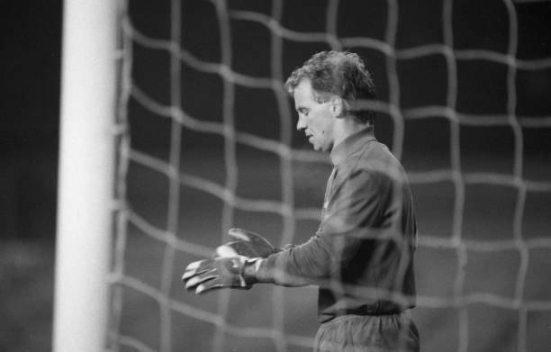 David Speedie of Chelsea takes the goalkeeper's gloves during the First Division match between Chelsea and Queens Park Rangers at Stamford Bridge on...