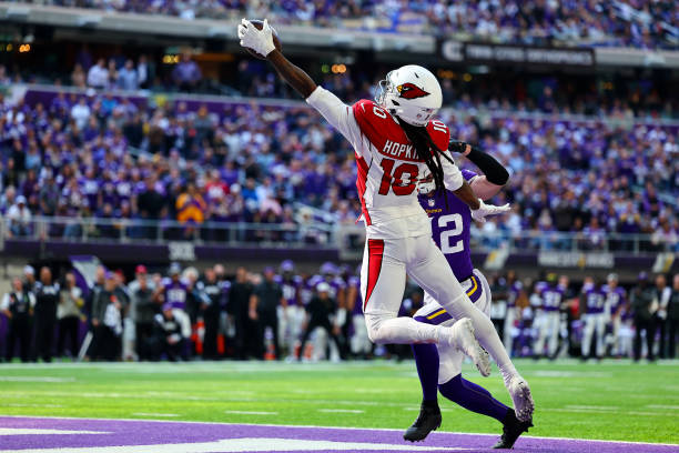 DeAndre Hopkins of the Arizona Cardinals catches the ball for a touchdown as Harrison Smith of the Minnesota Vikings defends during the second...