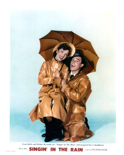 Debbie Reynolds and Gene Kelly in publicity portrait for the film `Singin` In The Rain`, 1952.
