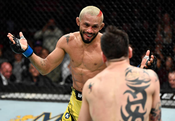 Deiveson Figueiredo of Brazil battles Brandon Moreno of Mexico in their UFC flyweight championship fight during the UFC 270 event at Honda Center on...