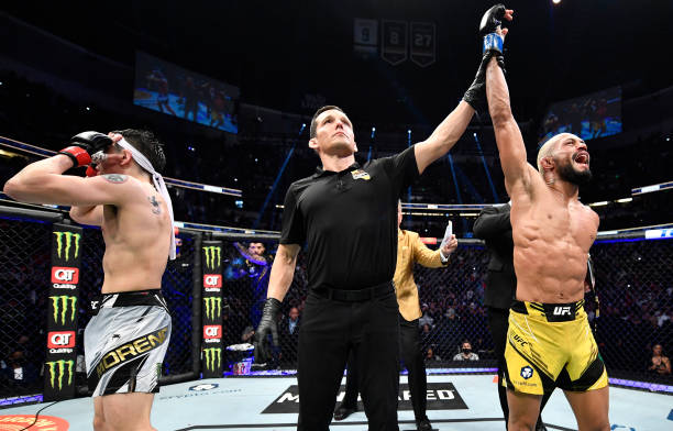 Deiveson Figueiredo of Brazil reacts after his decision victory over Brandon Moreno of Mexico in their UFC flyweight championship fight during the...