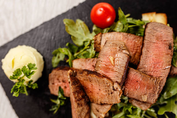 delicious tagliata steak on black stone board picture
