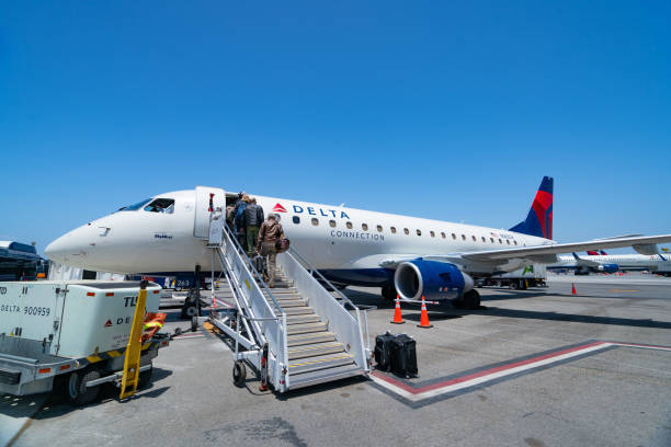 delta airlines embraer erj175 boards from public waiting area while picture