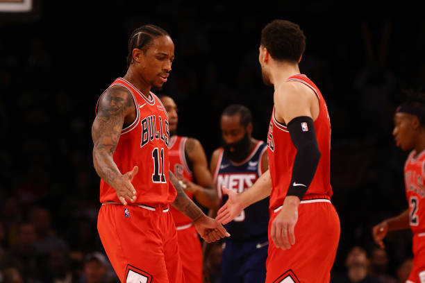 DeMar DeRozan of the Chicago Bulls celebrates with Zach LaVine \H at Barclays Center on December 04, 2021 in New York City. NOTE TO USER: User...