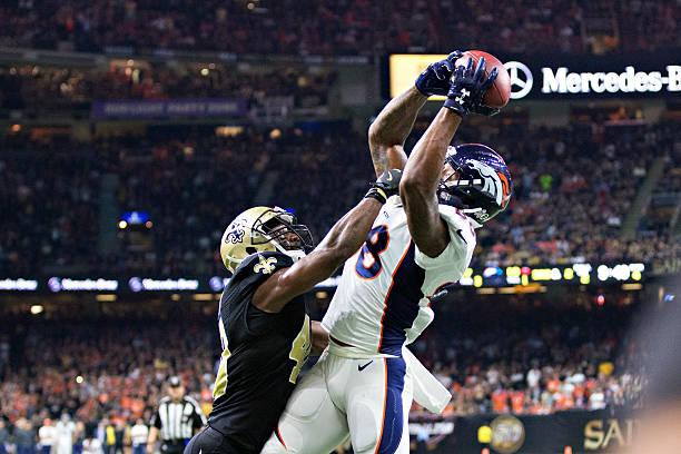 Demaryius Thomas of the Denver Broncos catches a touchdown pass over Delvin Breaux of the New Orleans Saints at Mercedes-Benz Superdome on November...