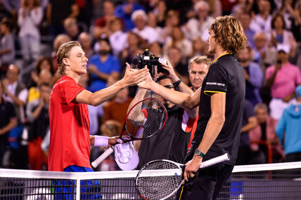 Denis Shapovalov of Canada congratulates Alexander Zverev of Germany for his 6-4, 7-5 victory during day nine of the Rogers Cup presented by National...