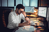 Depressed frustrated trader tired of overwork or stressed by bankruptcy